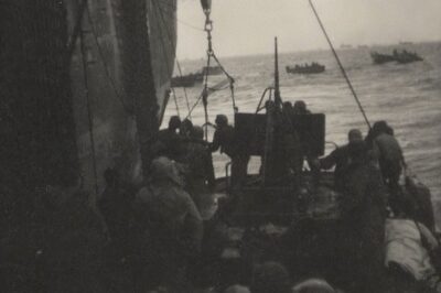 Photo: An 83-footer tied alongside a Navy attack transport to disembark a load of survivors.