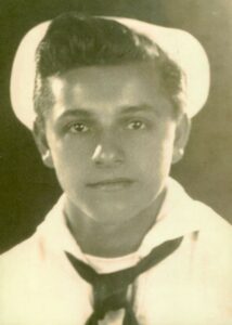 Official headshot of Frank DeVita in dress whites during World War II.