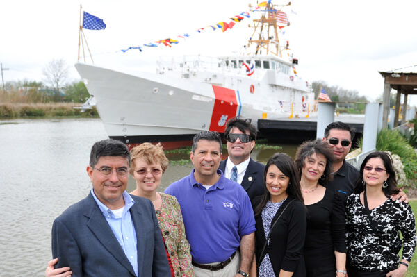 Photo: Family posing in front of fast response cutter.