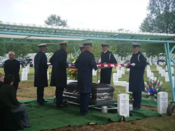 Photo: Coast Guard Honor Guard folding the flag at the funeral.