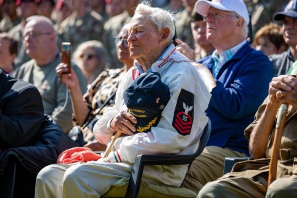Photo: Jack Hamlin seated during a memorial ceremony at Normandy.