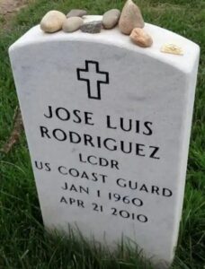 Photo: Headstone with the text “Jose Luis Rodriguez Lieutenant Commander U.S. Coast Guard, January 1, 1960 to April 21, 2010”