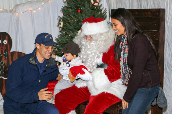 Photo: Coast Guard family visits with Santa