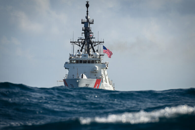Photo: U.S. Coast Guard Cutter Bertholf with waves in foreground.