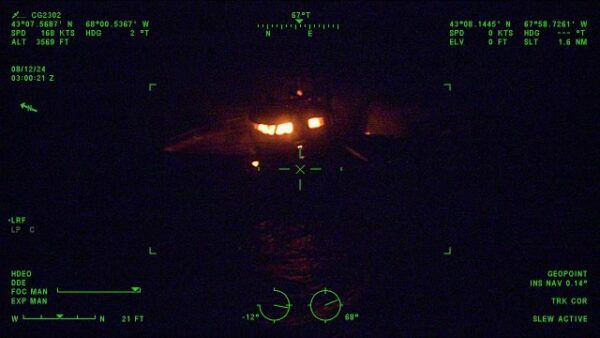 Photo: Tactical screen with location markings showing a vessel. Lights are visible through the windows of the vessel’s in this night image.