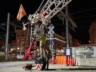 Photo: Workers diligently prepared for the raising of a crane at night.