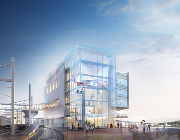 Color construction rendering of the National Coast Guard Museum south wall from the New London waterfront with a view of the visitor passageway over the train tracks and a Coast Guard HH60 hanging in the museum atrium.