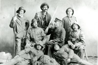 1894 posed photograph of Keeper Lawson surrounded by his NWU student surfmen.