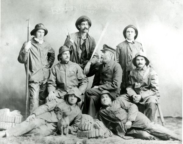 1894 posed photograph of Keeper Lawson surrounded by his NWU student surfmen.