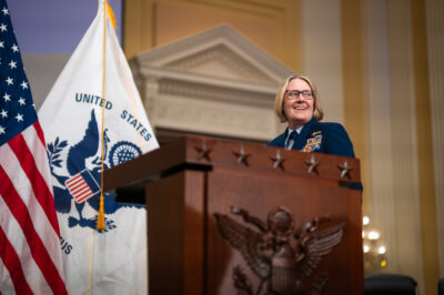 Photo: Admiral Linda L. Fagan standing behind a podium.