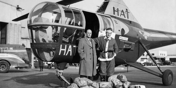 Photo: Flying Santa poses next to Sikorsky S-51.