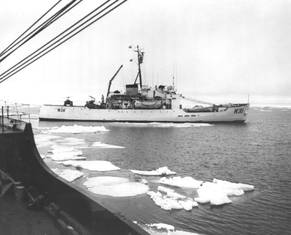 Taken from the deck of one of the 180-foot buoy tenders, this image shows CGC STORIS as the ice closes in.