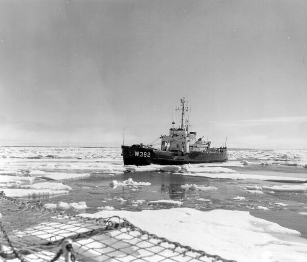 Black and white photograph of CGC Bramble in the icy waters of the Northwest passage.