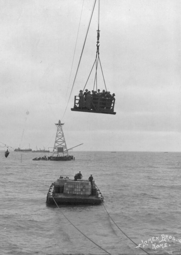 Photo: Aerial cable car ferries passengers over water.