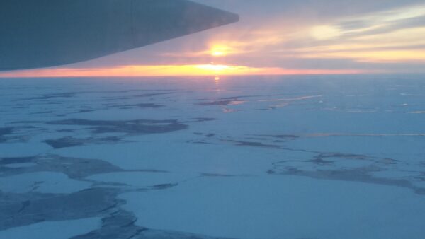 Photo: Aerial view of ice flow while the sun is low.
