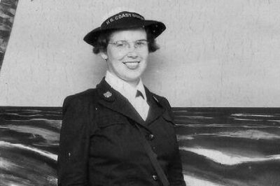 Black and white photograph, official portrait of Lois Bouton, 1943, at boot camp, Palm Beach in dark blue SPAR uniform.