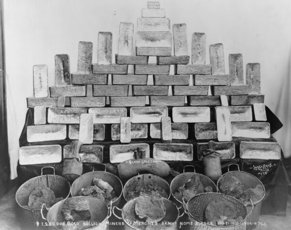 Photo: A stack of gold bricks and nuggets