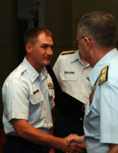 Photo: EM2 Rodney Gordon being decorated